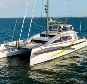 NDS Evolution luxury sailing catamaran cruising on open waters with a modern design and spacious deck.