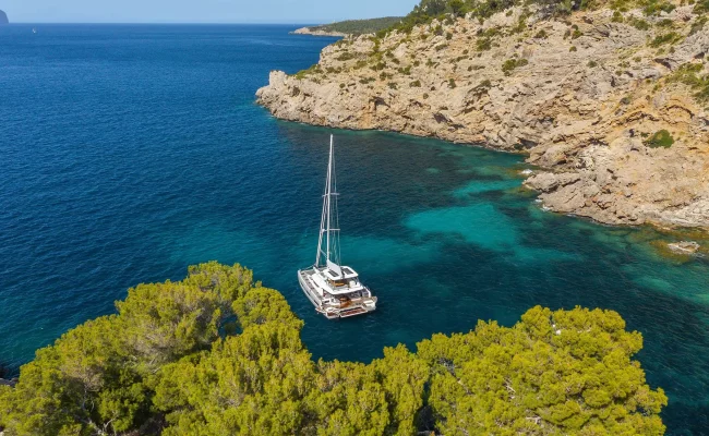 Lady M Catamaran anchored in a bay